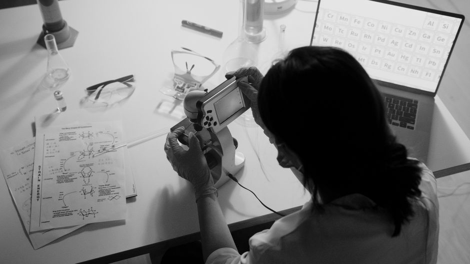 Researcher using a microscope in a laboratory