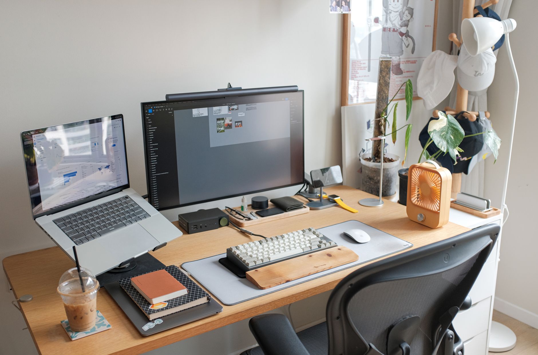 Laptop and monitor set up on a desk in a home office