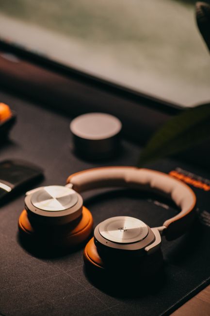 Over-ear noise-cancelling headphones resting on a desk workspace