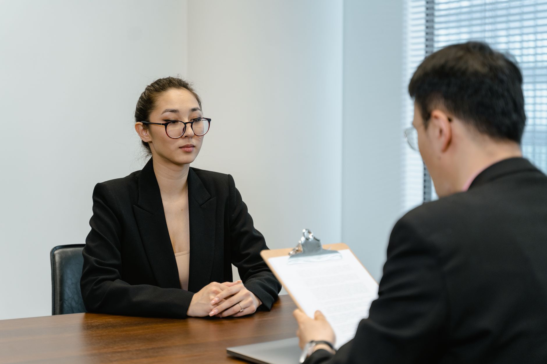 Two professionals in a business interview setting