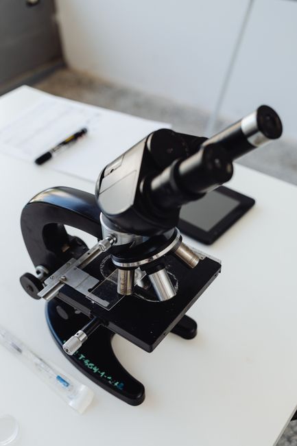 Close-up of a microscope on a laboratory table